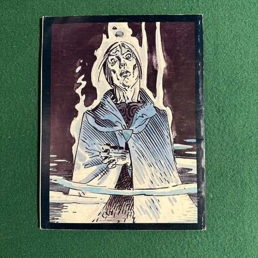 Vintage comic cover showing a pale figure in a blue cloak amid water